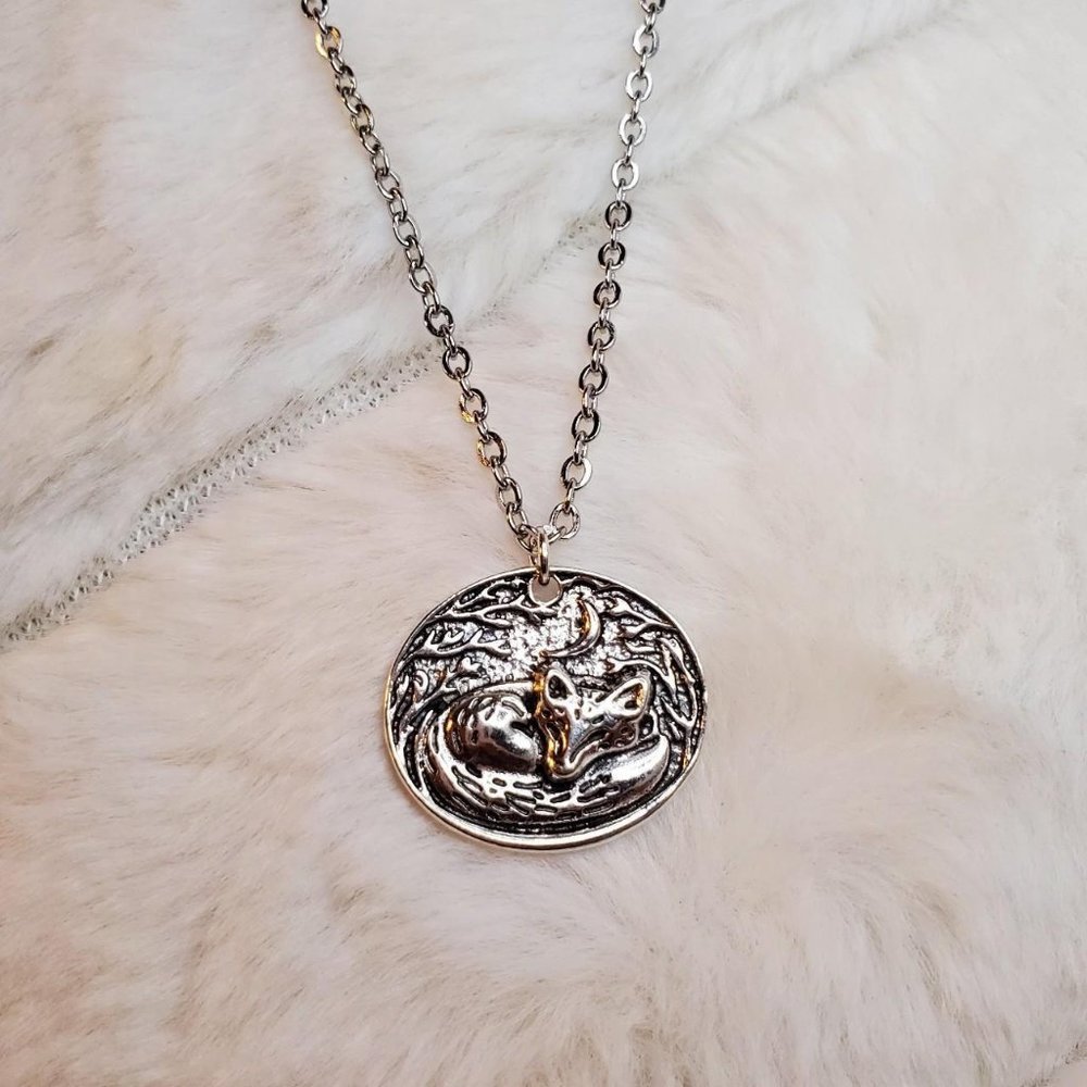 Sleeping fox charm necklace.